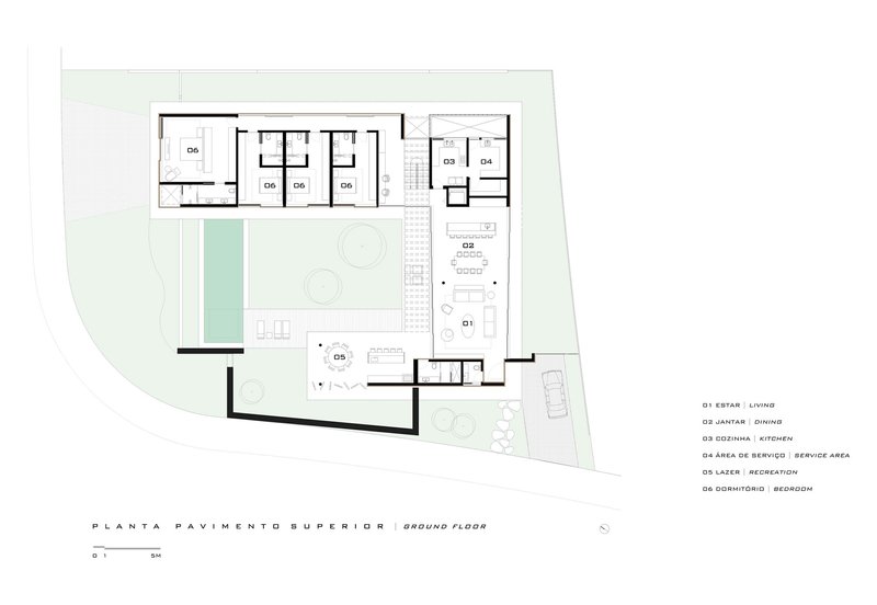 Ground floor plan drawing showing living, dining, kitchen, and bedroom spaces around central courtyard