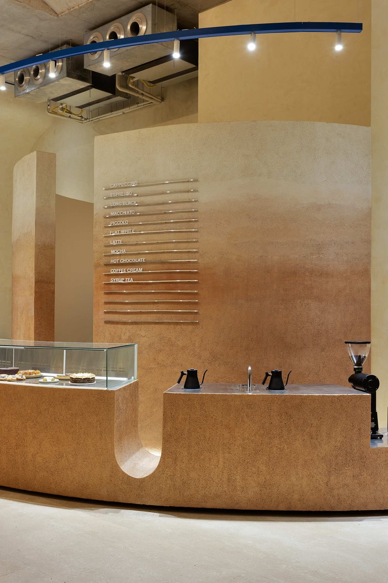 Cork counter detail with horizontal menu slots and circular portal opening at base