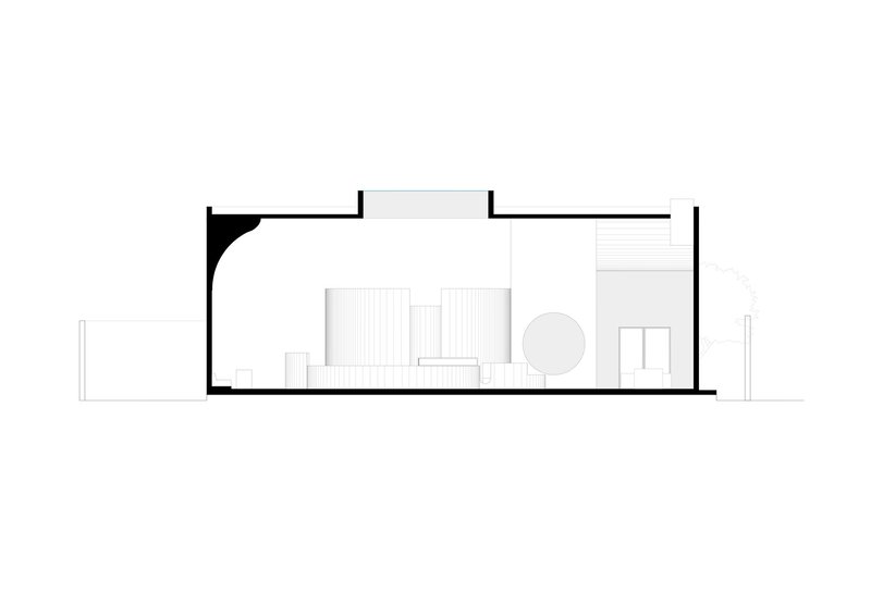 Section drawing showing interior spatial arrangement with curved wall element and furniture layout