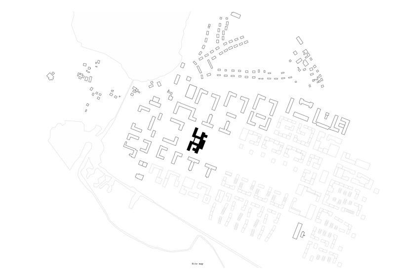 Site plan drawing showing building footprint highlighted in black within surrounding street grid