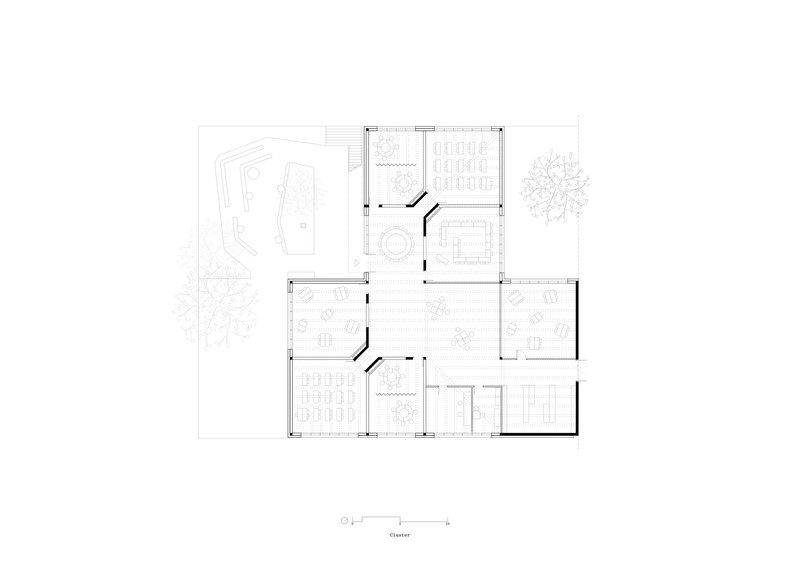 Floor plan drawing showing classroom spaces with circular elements and surrounding landscape