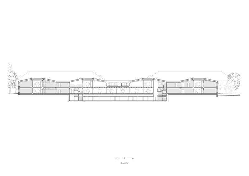 Section drawing showing a sprawling structure with curved roofs and multiple levels stepping down the site
