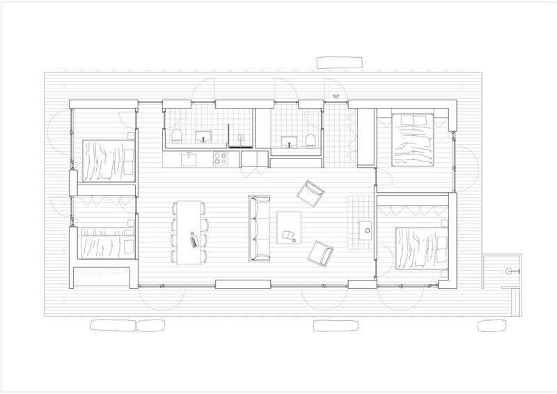 Floor plan drawing showing three bedrooms flanking a central living and kitchen area with exterior decks