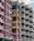 Studio Frozen Music Replaces a Generic Nashik Tower with a Stepped Brick and Concrete Housing Block