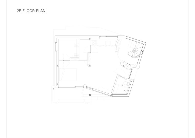 Floor plan drawing showing second level with spiral stair and kitchen at angled corner