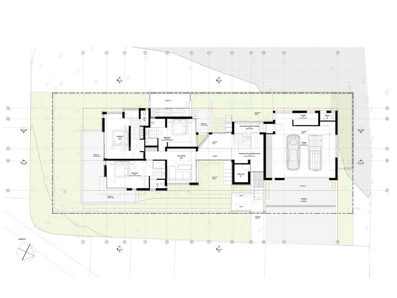 Ground floor plan showing living spaces, central staircase, and garage at right edge