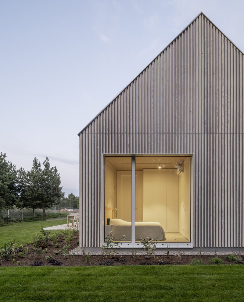 Archmondo Wraps a Masurian Lake House in Charred Larch and Standing-Seam Metal