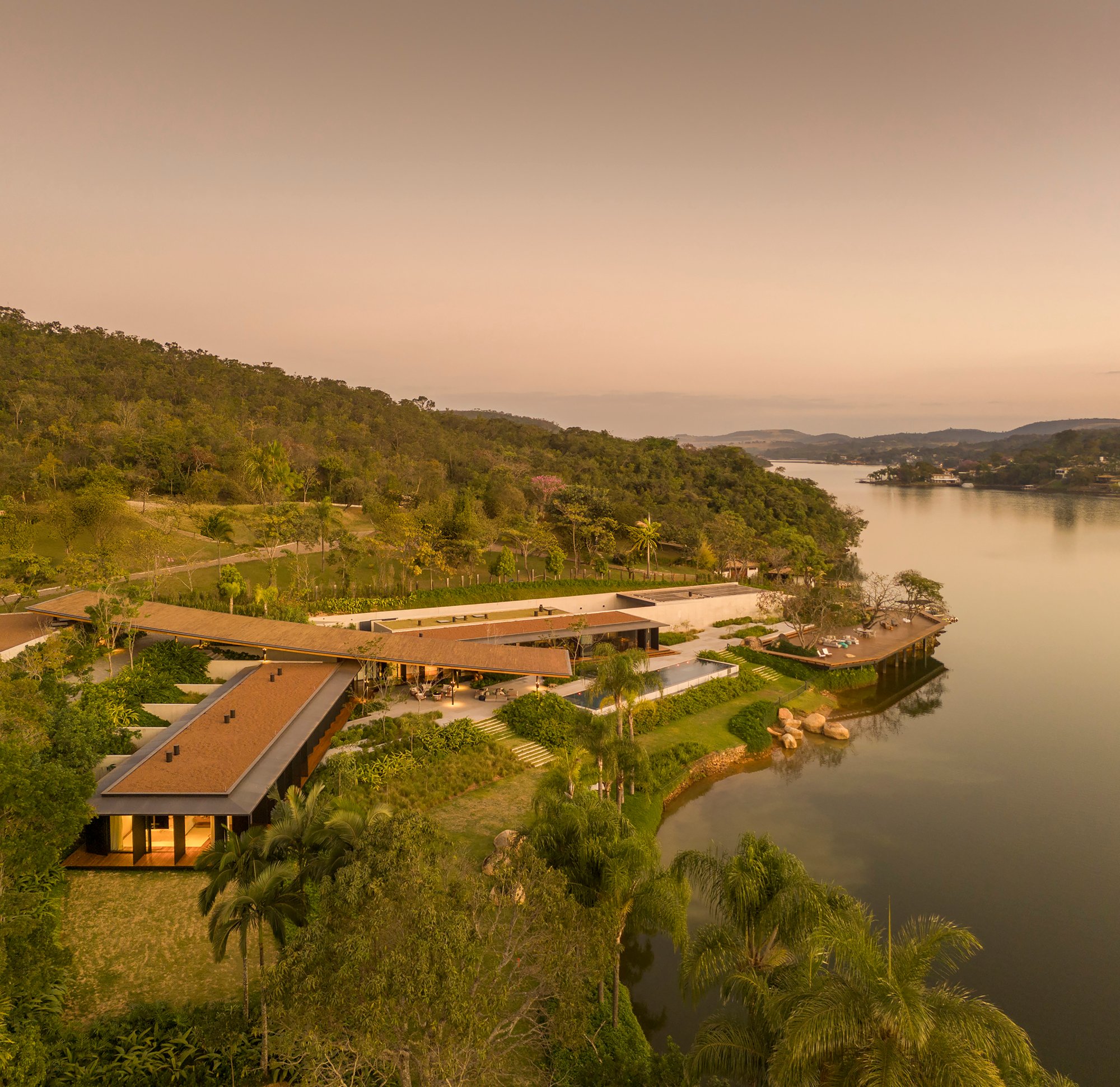 Bernardes Arquitetura Stretches a Timber Roof Along a Reservoir's Edge in Minas Gerais