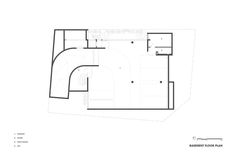 Basement floor plan drawing with curved exterior wall and central staircase serving garage and storage spaces
