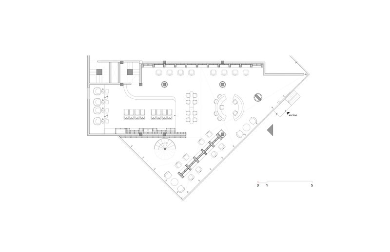 Floor plan drawing showing an angled layout with service stations, seating areas and enclosed treatment rooms