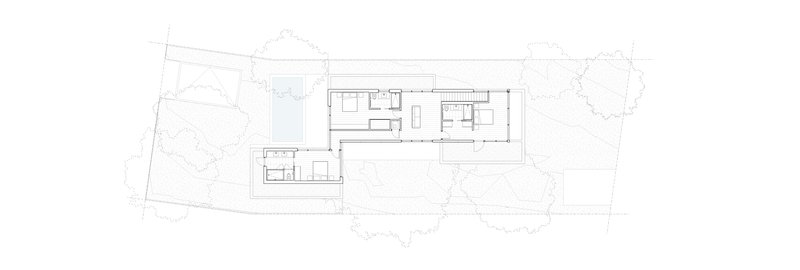 Floor plan drawing showing upper level with bedrooms, kitchen and staircase adjacent to pool below
