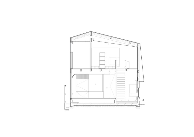 Section drawing revealing a two-story interior with pitched roof, staircase, and built-in storage