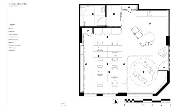 Floor plan drawing showing workstations, bathroom facilities, and circular meeting table in open office layout