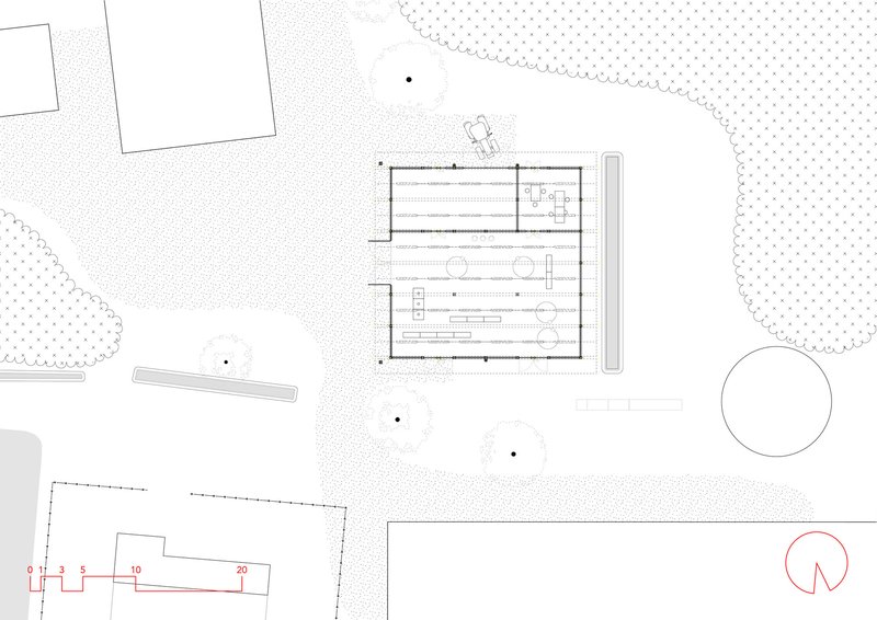 Site plan drawing showing the building footprint with surrounding landscape and adjacent structures
