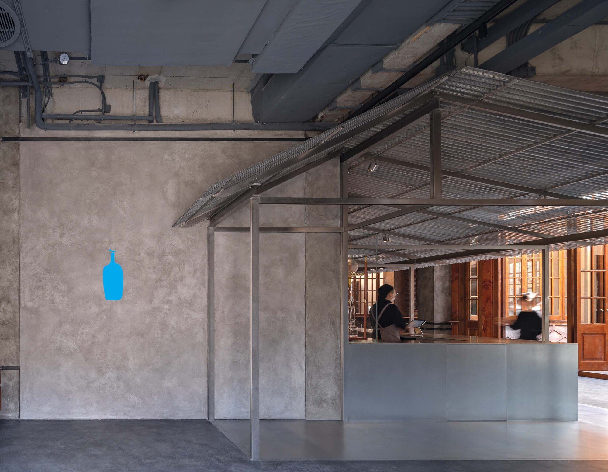 Neri&Hu Grafts a Lightweight Steel Shelter into a 140-Year-Old Shikumen for Blue Bottle Coffee