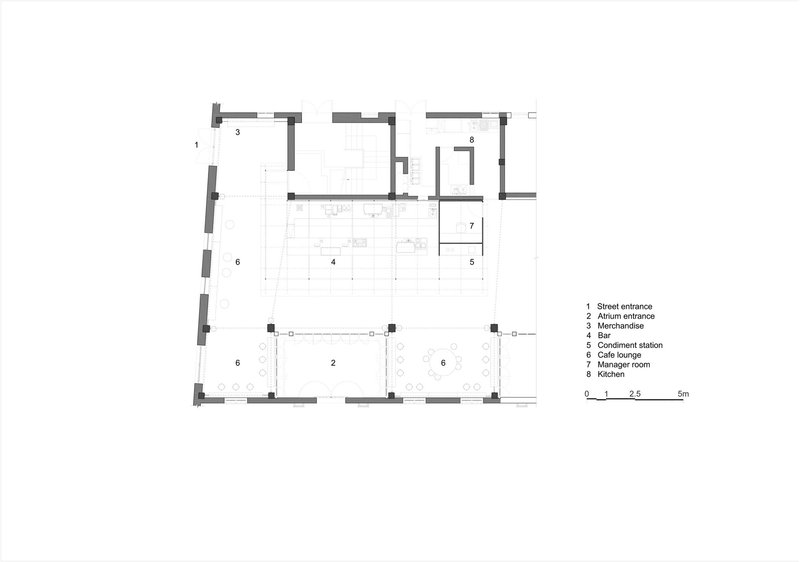 Floor plan drawing indicating spatial layout with central bar and adjacent lounge areas