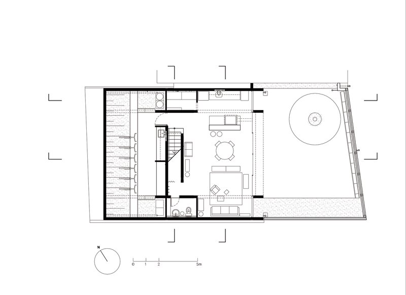 Ground floor plan showing living area with central stair and exterior terrace with circular pool