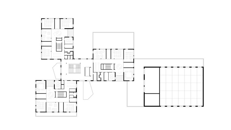 The image presents a detailed floor plan of a modern building, showcasing a complex arrangement of rooms, corridors, and staircases. The design emphasizes geome