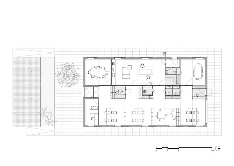 Floor plan drawing showing open workspace with multiple dining zones and courtyard tree