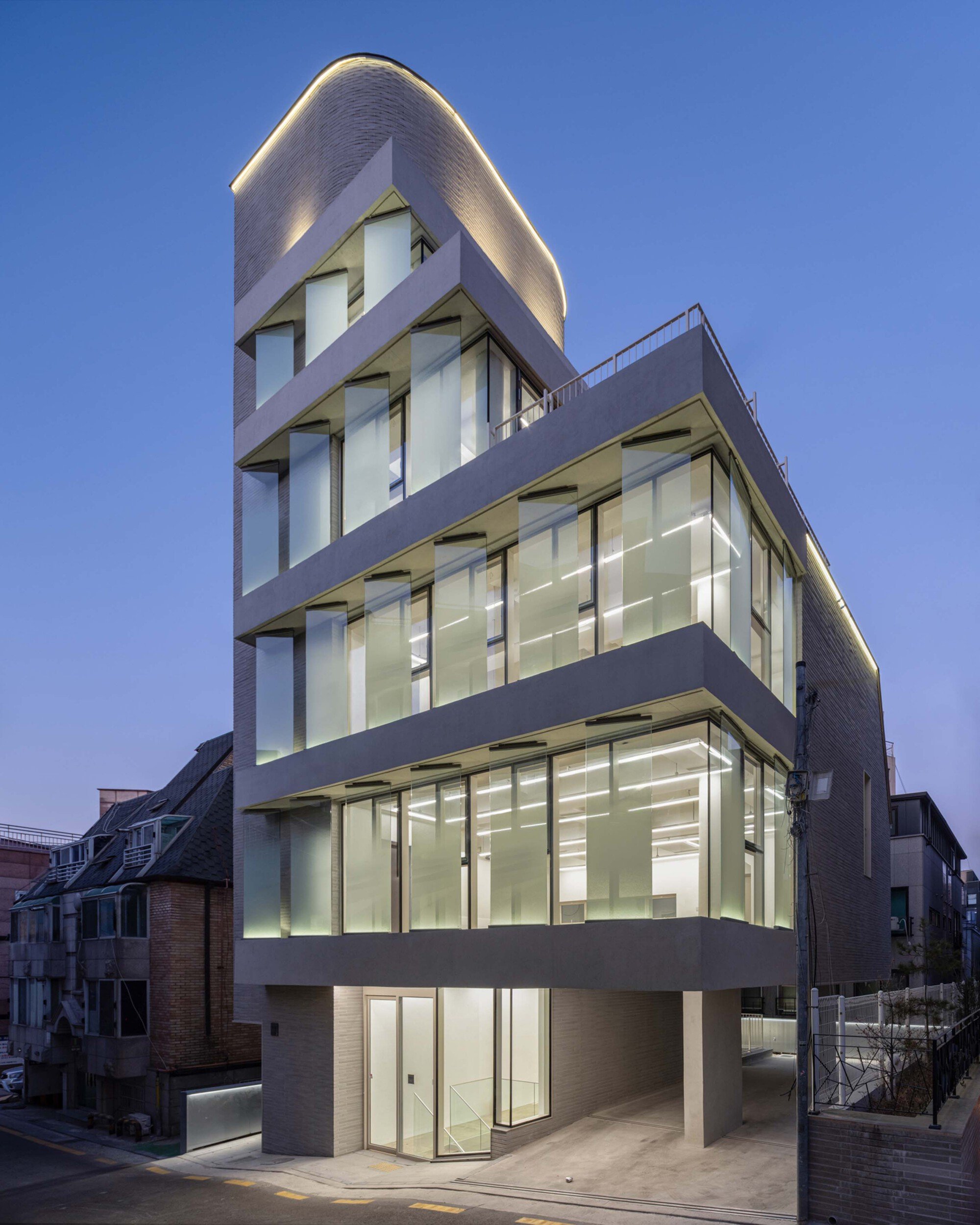 See Architects Stacks Concrete Slabs and Gradient Glass to Animate a Gangnam Corner at Night