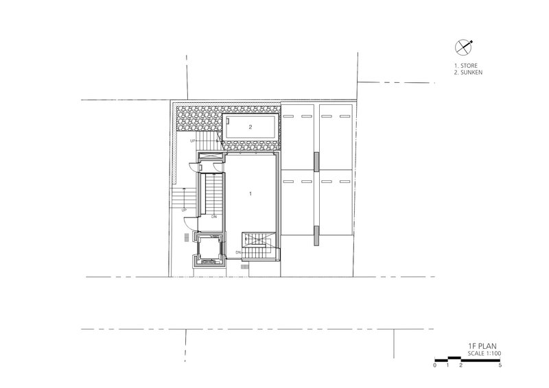 First floor plan drawing showing entry, stair core and sunken courtyard with planted area