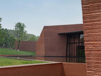 Line, Studio, and GAD Scatter Five Stone Volumes Across a Yunnan Hilltop to Form a Cultural Center