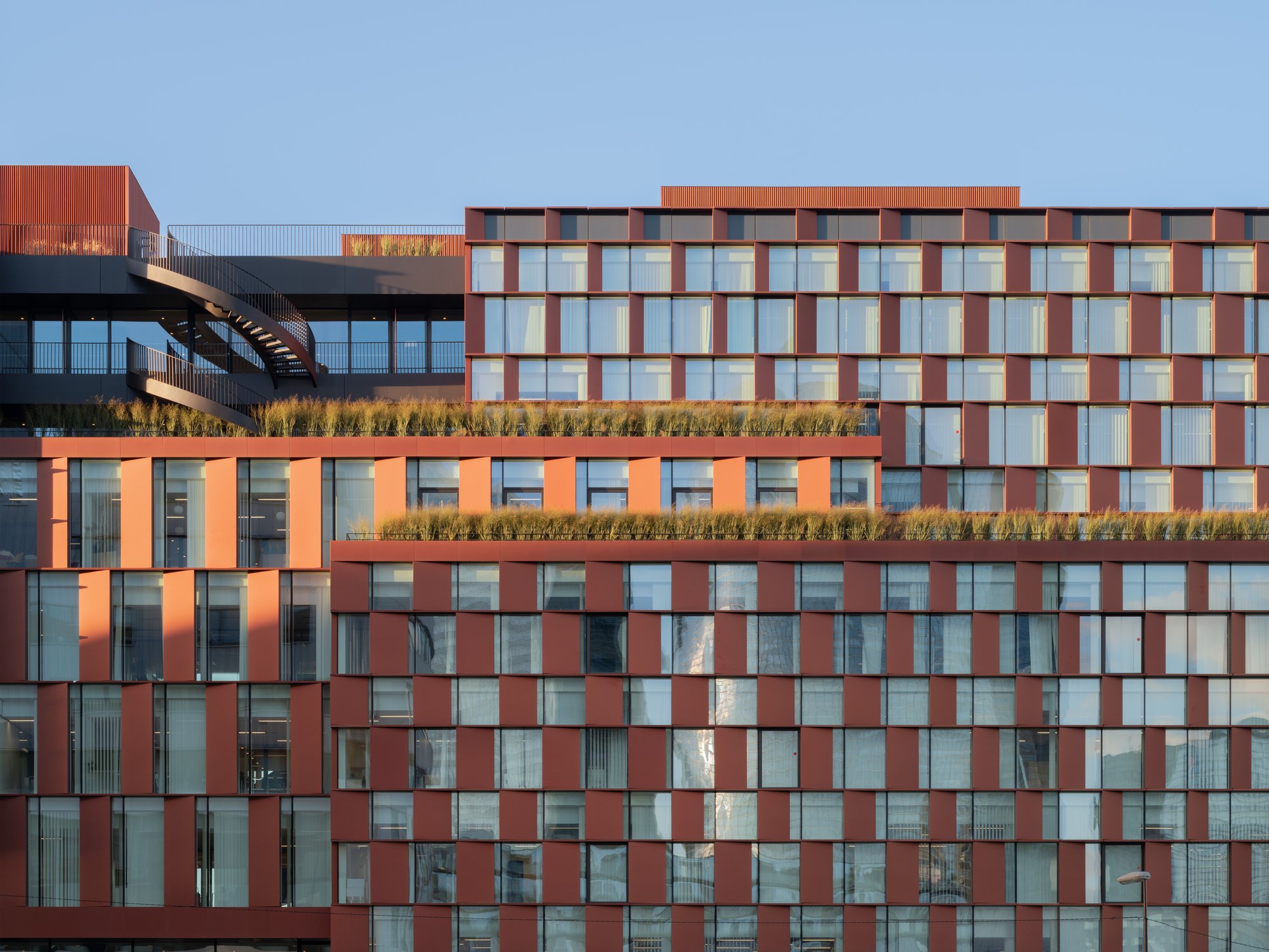 3XN and SRA Architectes Stack a Lenticular Hotel and Office Over Paris Railway Tracks