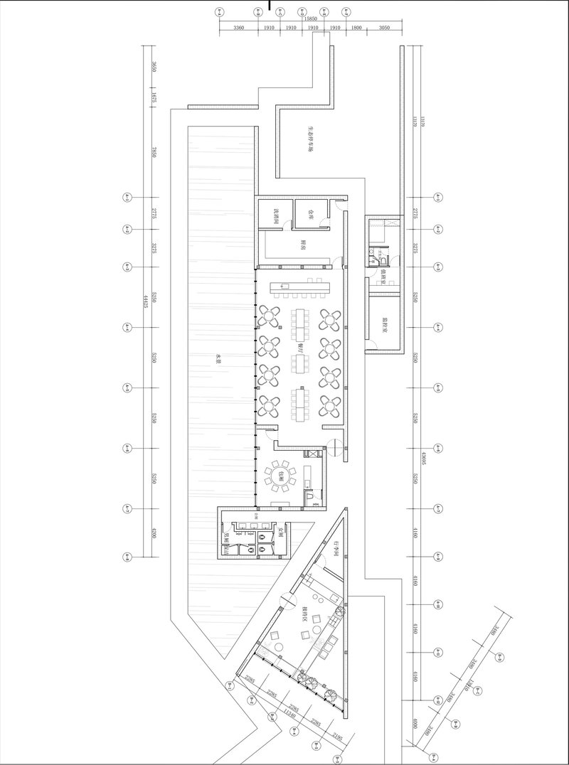 Floor plan showing elongated dining hall with rows of seating and angled wing extension