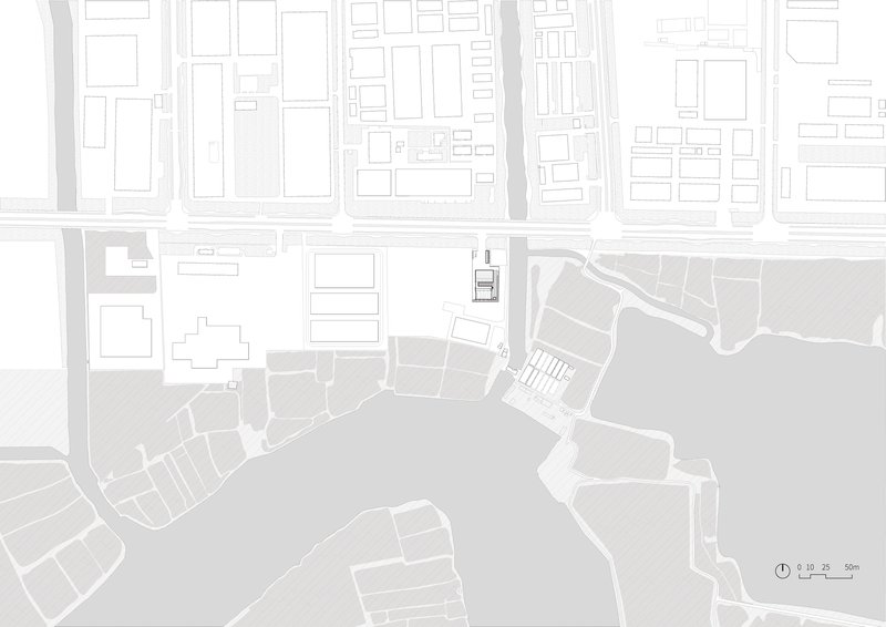 Site plan drawing showing the building footprint positioned between urban blocks and a waterfront edge
