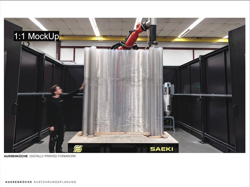 Robotic arm printing a full-scale ribbed curved wall in a fabrication workshop