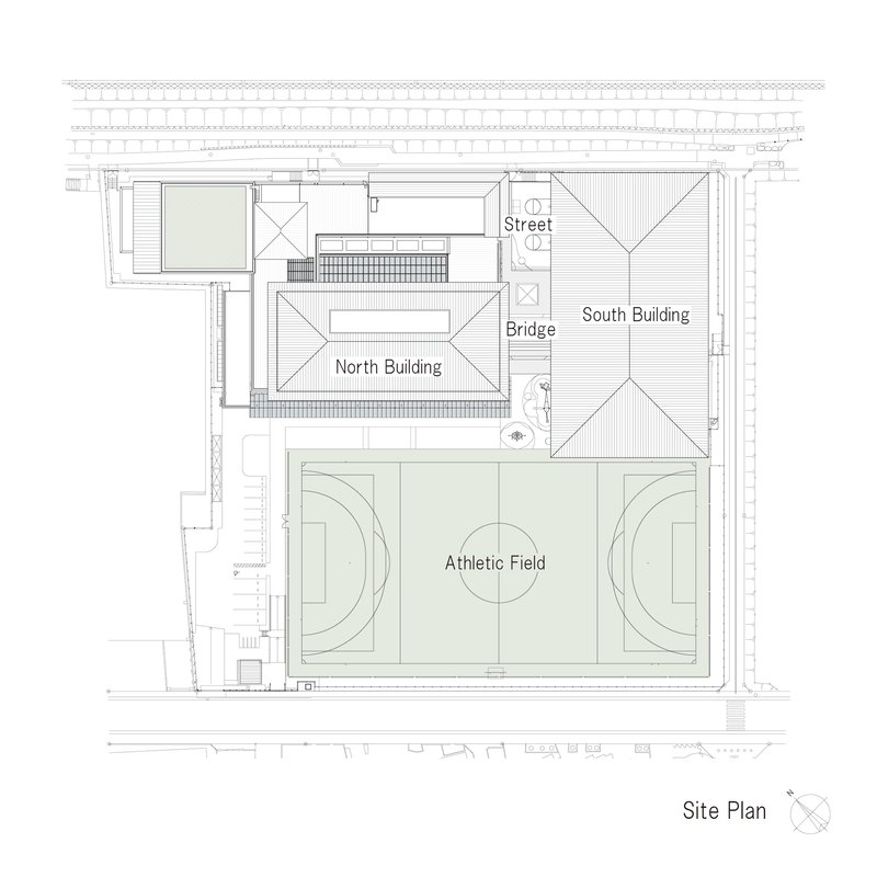 Site plan drawing showing two buildings flanking an athletic field and connected by a bridge