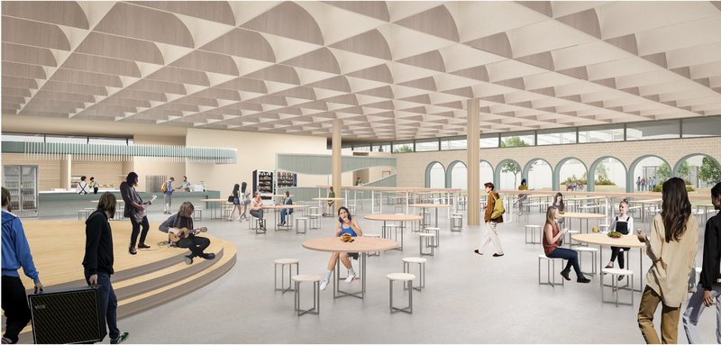 Multi-functional cafeteria designed as a social hub blending dining, performance, and informal learning.