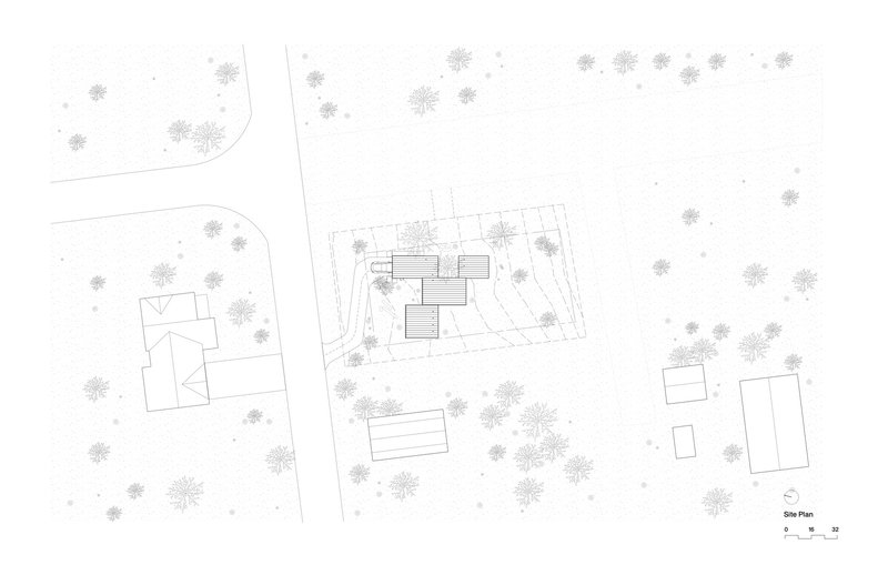 Site plan drawing showing a cluster of volumes among scattered trees and adjacent buildings