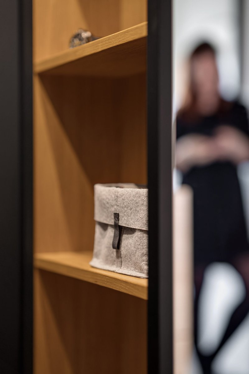 Detail of custom shelving highlighting craftsmanship and material contrast