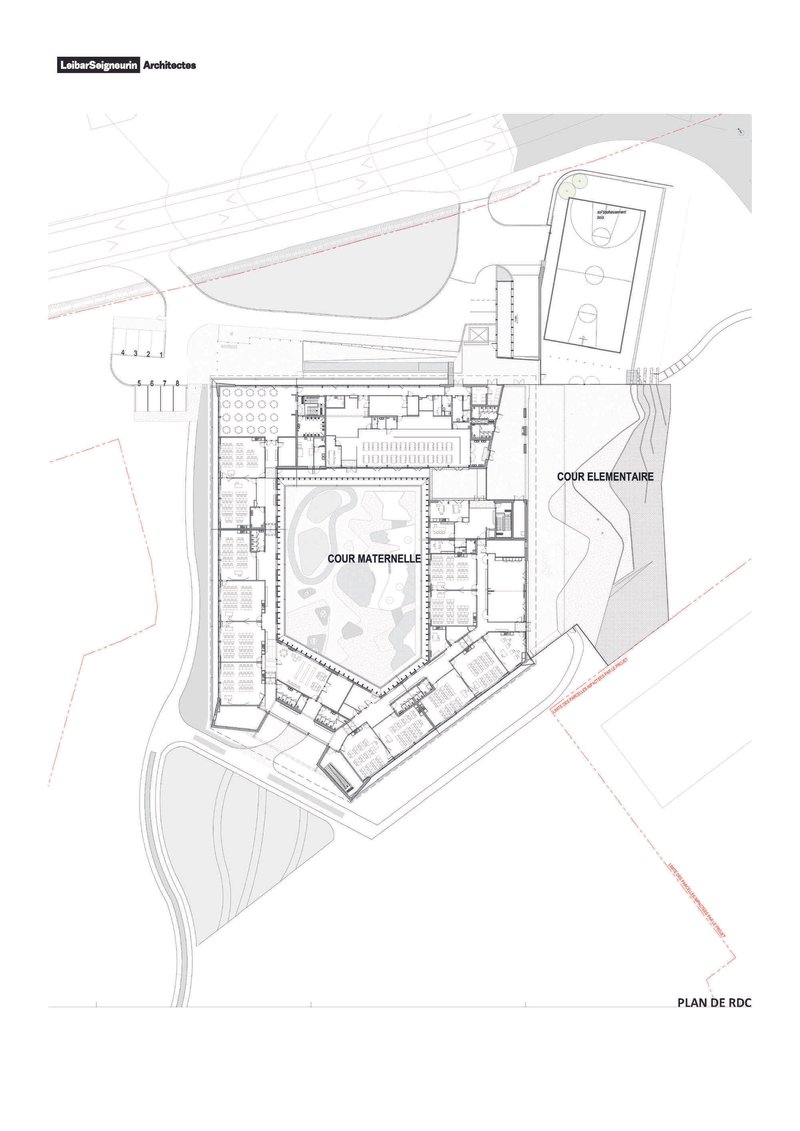 Ground floor plan drawing showing classroom wings arranged around two courtyards and a sports field