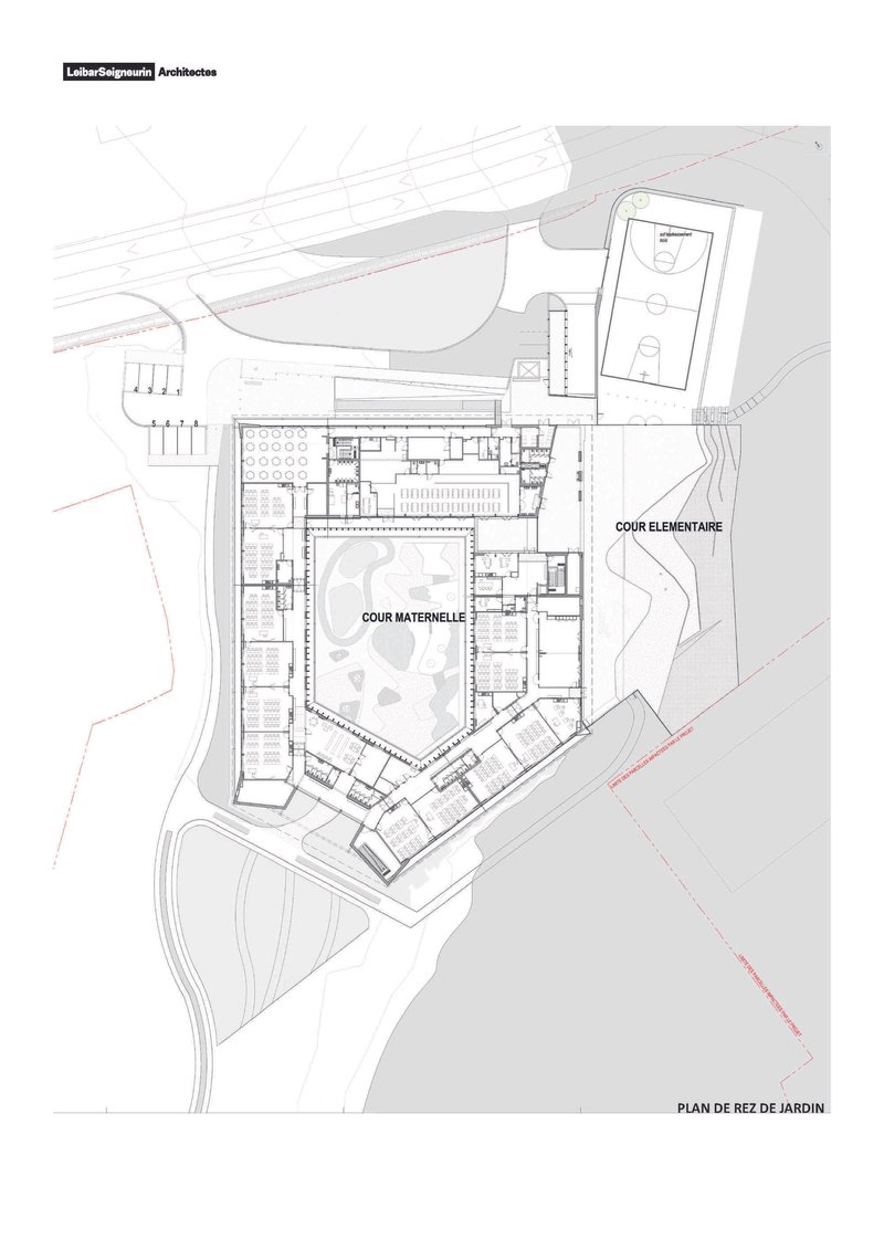 Ground floor plan drawing showing classroom wings with two courtyards and adjacent sports field