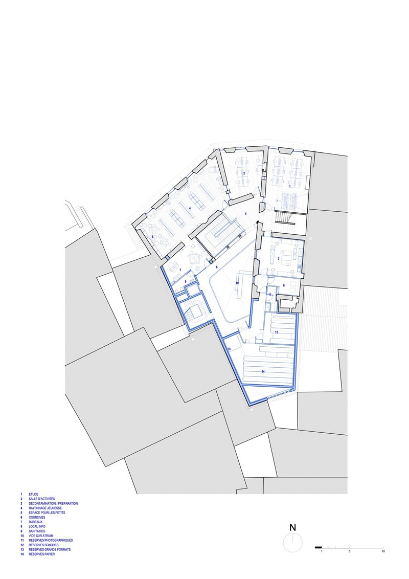 Floor plan drawing showing angled rooms and circulation within a curved building footprint