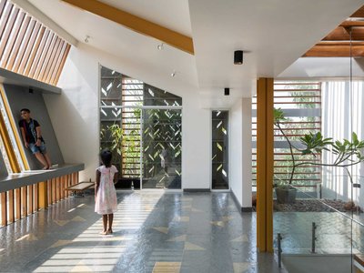 Studio WhiteScape Wraps a Bengaluru Home in Concrete Lace and Trumpet Tree Gold