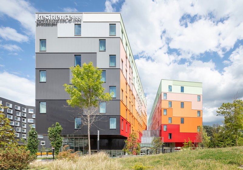 Manuelle Gautrand Wraps Two Airport Hotels in a Single Gradient Facade at Paris CDG
