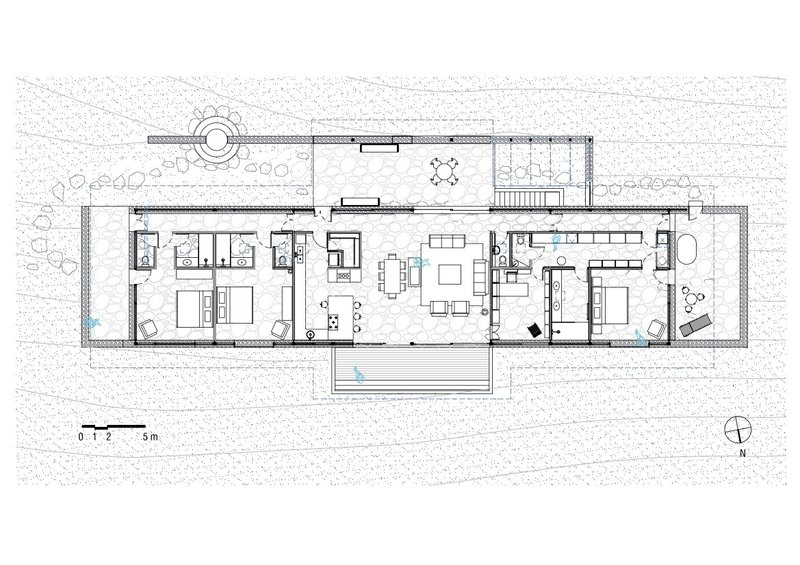 Floor plan drawing showing linear arrangement of bedrooms and living spaces with central courtyard