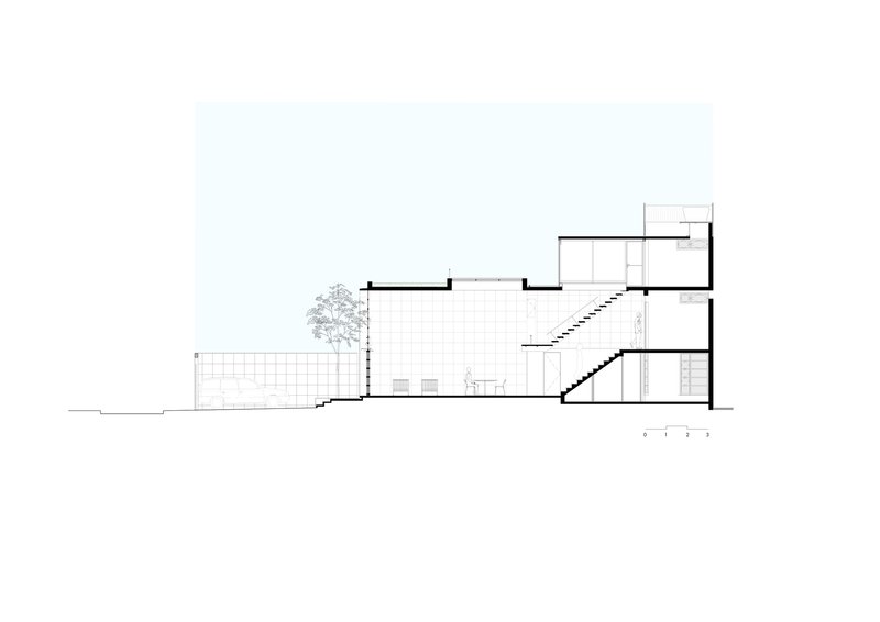 Section drawing showing a multi-level building with a central courtyard, diagonal staircase, and tree