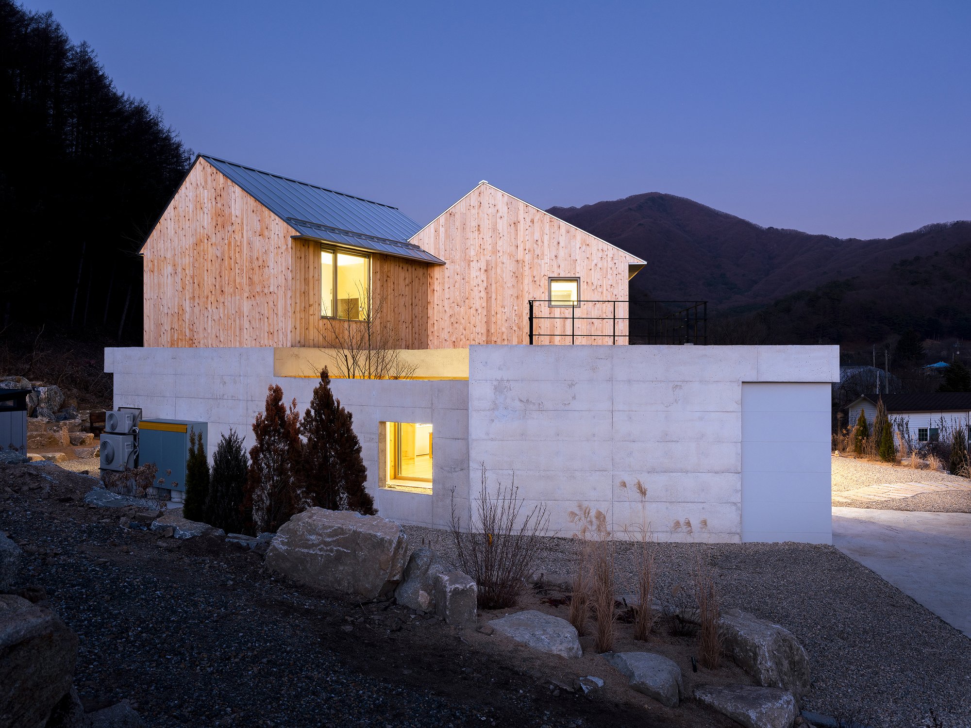 BRBB Architects Stack Timber Gables on a Concrete Plinth for an Elderly Couple's Mountain Retreat