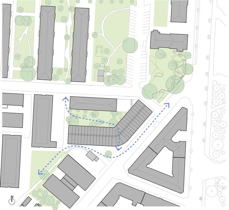 Site plan drawing showing an angled roofline with surrounding buildings, landscaped areas, and pedestrian circulation paths marked in blue