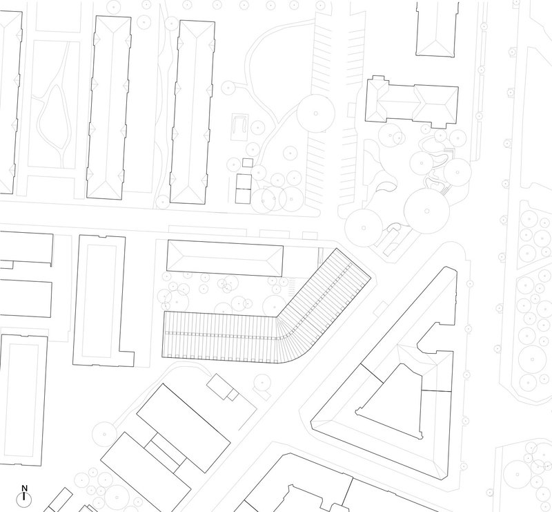 Site plan drawing showing an angular building footprint with adjacent structures, trees, and circulation routes in a urban block