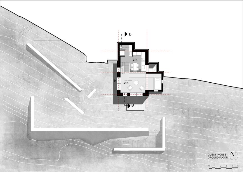 Ground floor plan drawing showing a house with linear retaining walls on a sloped site