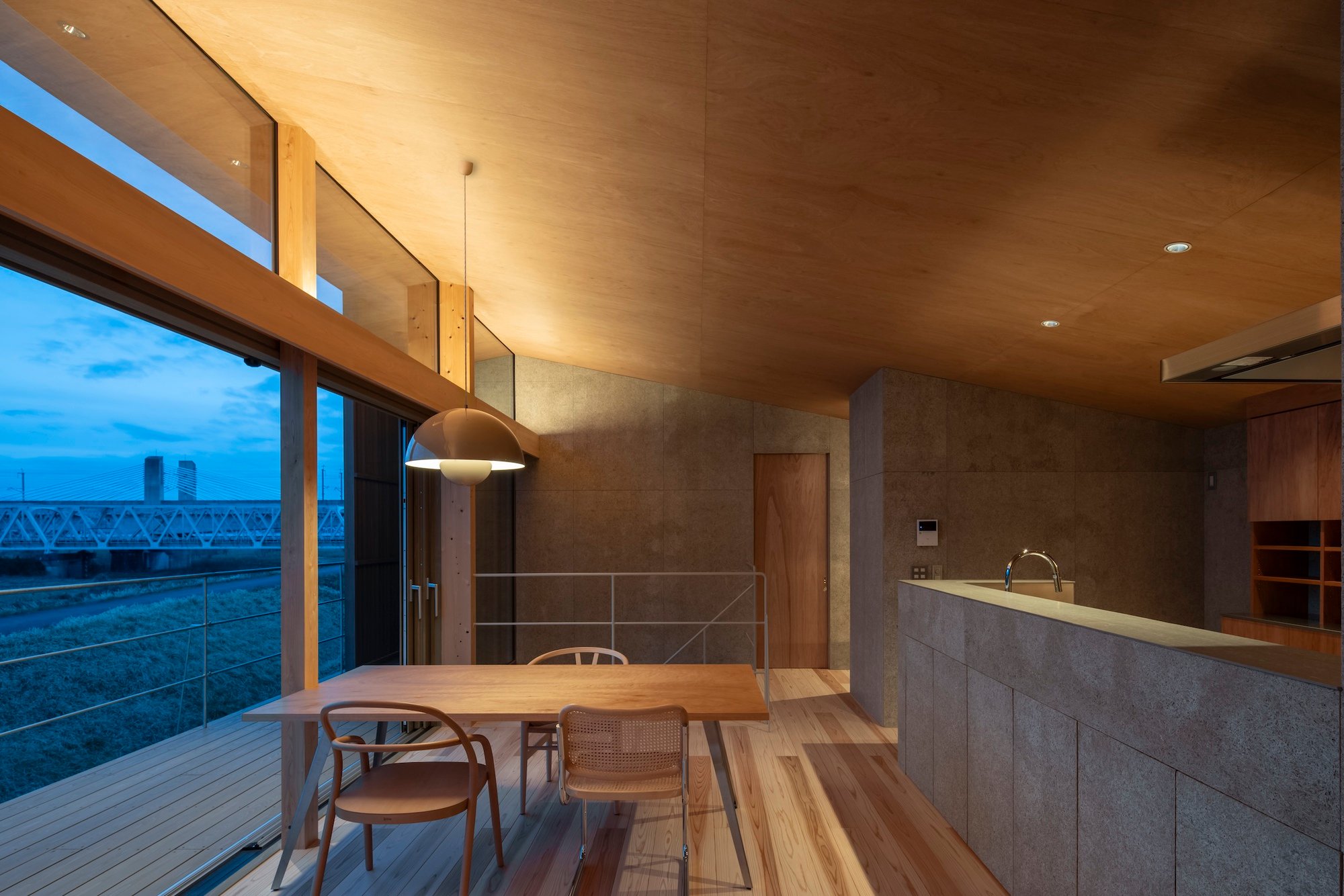studioSHUWARI Frames the Tateyama Mountains from a Toyama Riverbank House