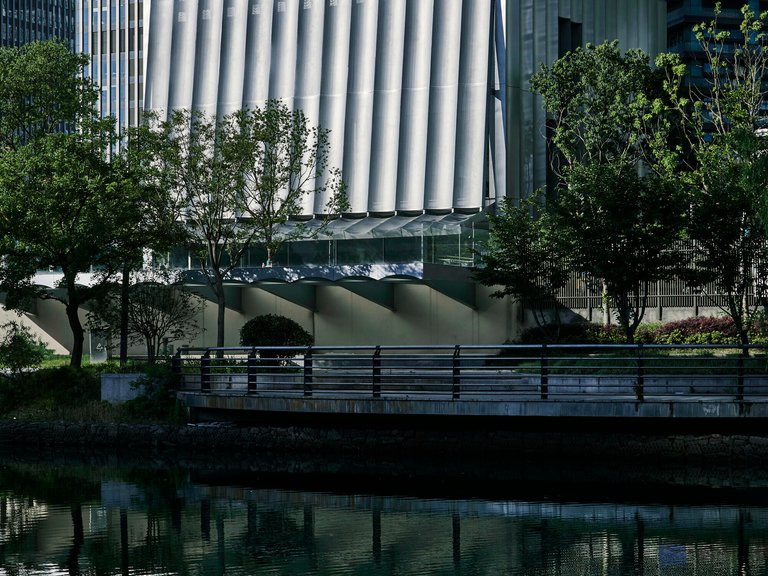 TAOA Wraps an Unfinished Ruin in Fluted White Armor