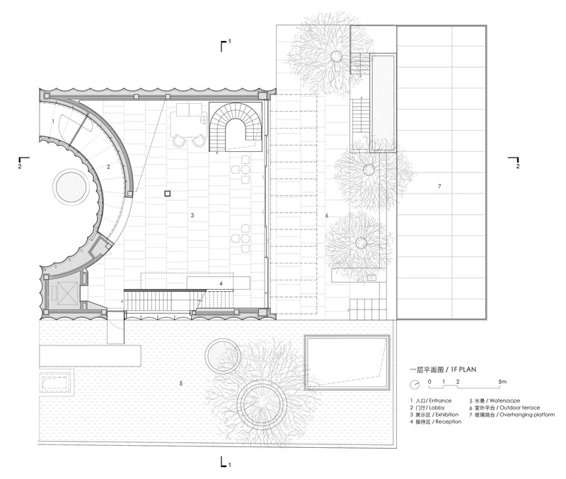 Ground floor plan drawing showing curved lobby walls, outdoor terrace with plantings, and central staircase