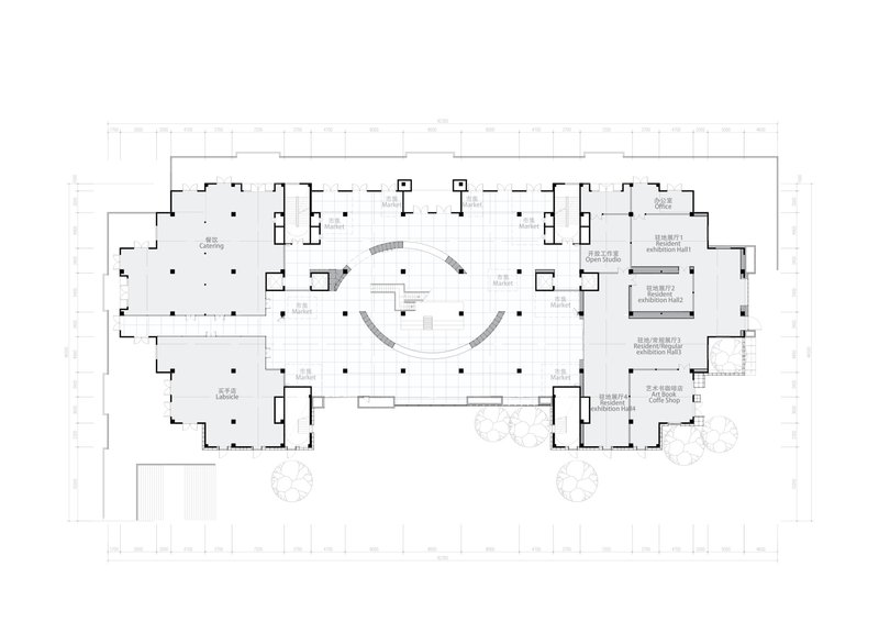 Floor plan drawing showing two curved staircases flanking a central space with perimeter rooms