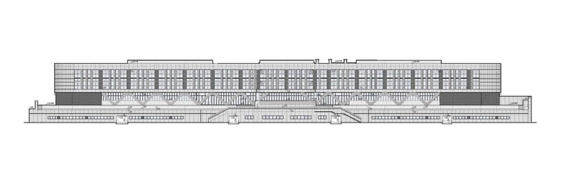 Elevation drawing showing a long horizontal building with a gridded upper facade and stepped lower levels